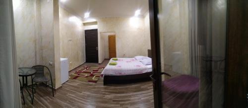 a small bedroom with a bed in a room at Batumi Homestay at Tamar Mephe Avenue in Makhinjauri