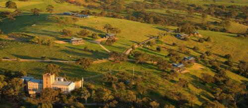 an aerial view of a house on a hill at Barossa Pavilions & Glasshouse in Lyndoch