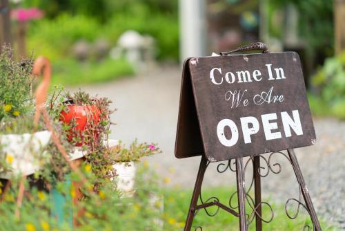 a sign that says come in we offer open at Country House Exclamation Mark & Comma in Namhae