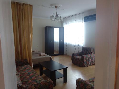 Uma área de estar em Apartment Khimshiashvili 9