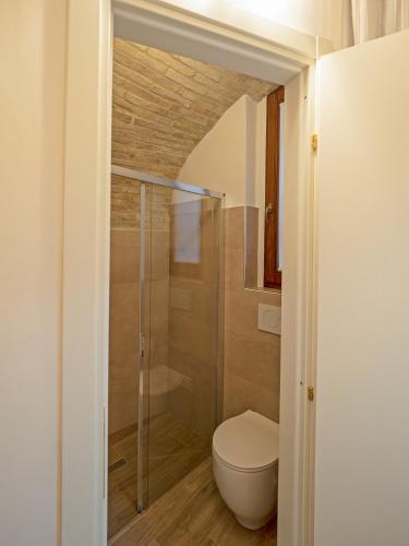 a bathroom with a toilet and a shower at Residenza Porta Perlici Assisi Apartment in Assisi