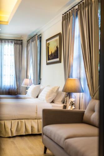 Ένα ή περισσότερα κρεβάτια σε δωμάτιο στο Merchant Villa- SHA Extra Plus