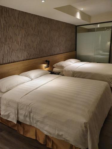 Ένα ή περισσότερα κρεβάτια σε δωμάτιο στο City Suites - Taoyuan Station