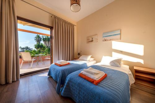 Ένα ή περισσότερα κρεβάτια σε δωμάτιο στο Hawaii Accommodation Pelekas