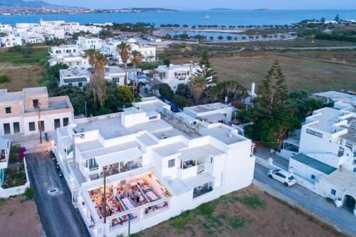 an aerial view of a white house with the ocean at Pavlos Place in Antiparos Town