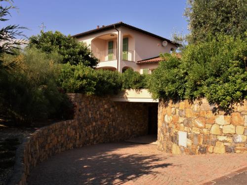 a house on top of a stone wall at Antico Principato di Seborga in Vallebona