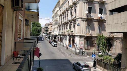 a view of a city street with cars on the road at Suite time Van Gogh in Catania