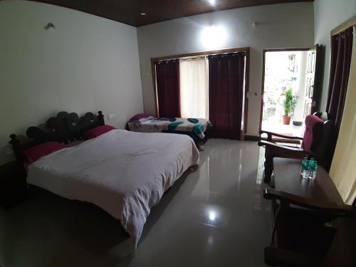 Voodi või voodid majutusasutuse RAI COTTAGE @ Coorg ,Suntikoppa toas