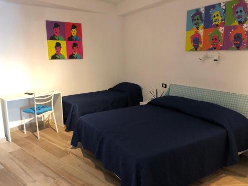 Un pat sau paturi într-o cameră la Bersaglio