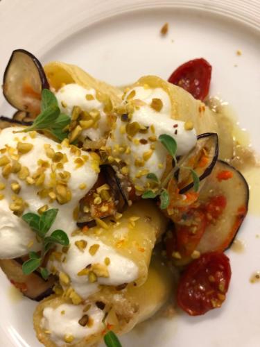a white plate of food with food on it at Residenza Del Lago in Candia Canavese