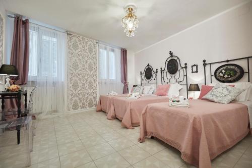 A bed or beds in a room at Il Piccolo Principe Affittacamere