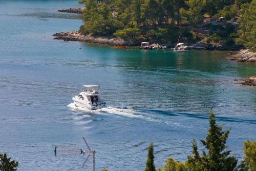 a small boat on a river at Guest House Marinna in Vrboska