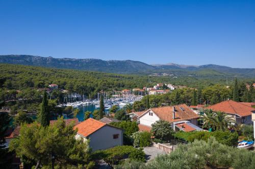 a view of a small town with a marina at Guest House Marinna in Vrboska