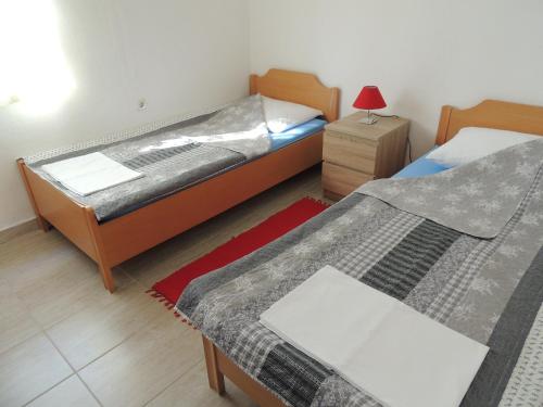 Postel nebo postele na pokoji v ubytování Apartman Tea