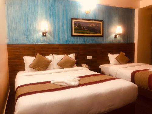 Ένα ή περισσότερα κρεβάτια σε δωμάτιο στο Hotel Guru