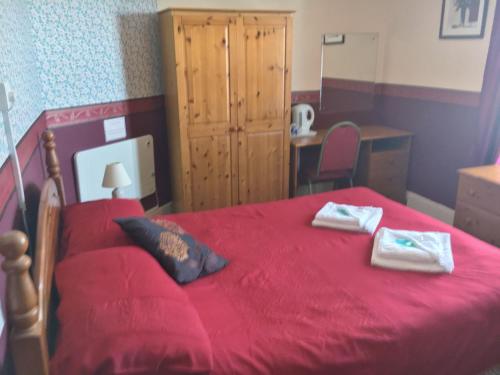 A bed or beds in a room at Chester Lodge 