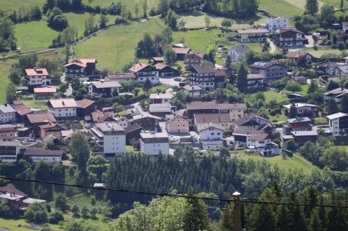 a small village on a hill with houses at Ferienwohnung Lenz in Sautens
