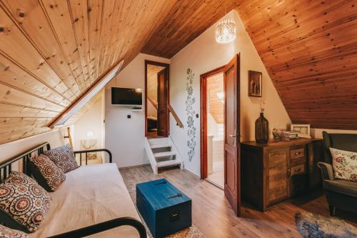 Un televizor și/sau centru de divertisment la Szent György Cottage