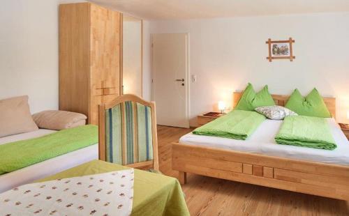 Postel nebo postele na pokoji v ubytování Appartement Königslehen