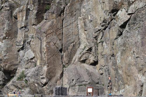 a rocky mountain with people standing next to it at Ferienwohnung Lenz in Sautens