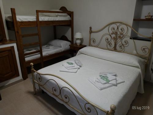 Posteľ alebo postele v izbe v ubytovaní Az. Agrituristica U'SPIGU