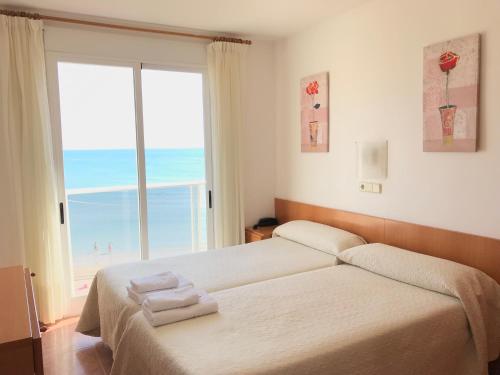 Postel nebo postele na pokoji v ubytování Hotel Mare Nostrum