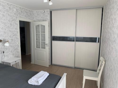 Postel nebo postele na pokoji v ubytování Kuressaare Park Apartment