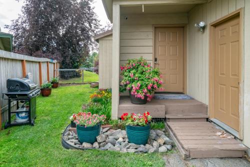 a house with three potted plants on the front door at Polar Bear Den in Anchorage