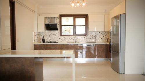 Μια τηλεόραση ή/και κέντρο ψυχαγωγίας στο Orchid Hills - heated swimming pool