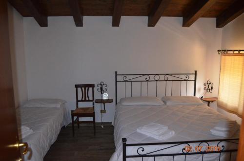 Ένα ή περισσότερα κρεβάτια σε δωμάτιο στο Agriturismo il Vignale