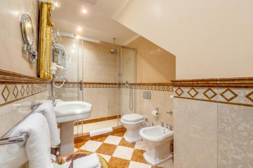 a bathroom with a sink and a toilet and a shower at Alchymist Grand Hotel and Spa - Preferred Hotels & Resorts in Prague