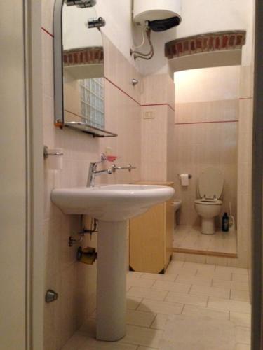a bathroom with a sink and a toilet at Via Scappini in Rio Marina