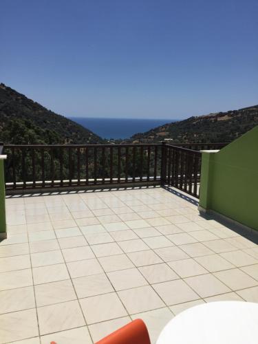 a balcony with a view of the ocean at Saint George Hotel in Rodakino
