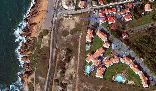 an aerial view of a building next to the ocean at Maison de vacance proche de la mer in Les Sables-dʼOlonne