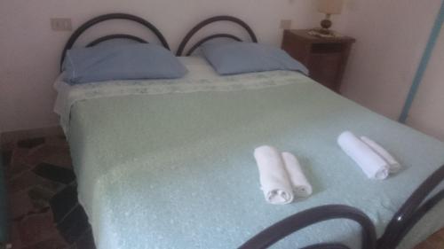 Łóżko lub łóżka w pokoju w obiekcie Hotel Alberta