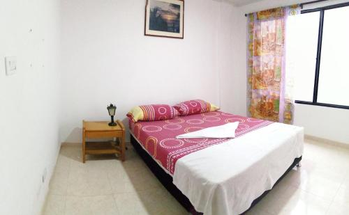 A bed or beds in a room at Hospedaje La Pradera 3 y 7 días -OFF