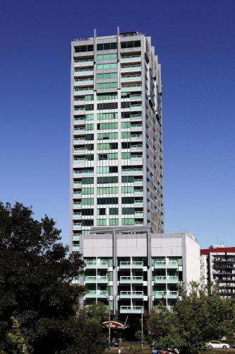 a tall building with a lot of windows at Seasons Botanic Gardens in Melbourne