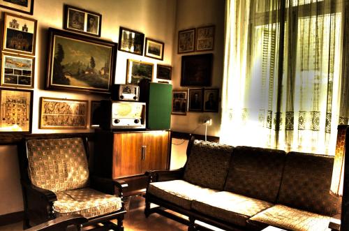 a living room with a couch and two chairs at Acropolis House in Athens