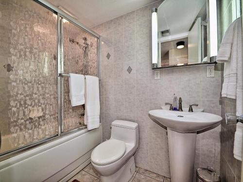 a bathroom with a toilet and a sink and a shower at 440 West Condos 1508S Walk to the Beach 555 in Clearwater Beach