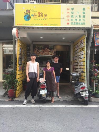 a group of three people standing in front of a store at 在路上 in Lukang
