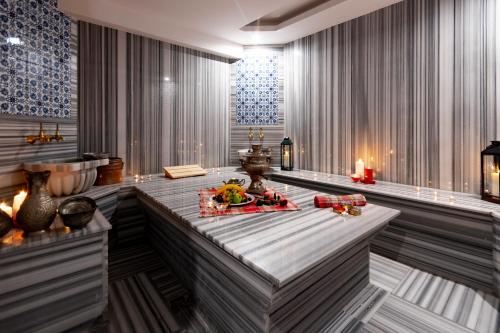 a lobby with a table with food and candles at Antusa Design Hotel & Spa in Istanbul