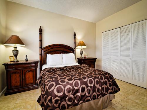 a bedroom with a large bed and two night stands at Regatta Beach Club 414S 1 Bedroom Condo - Regatta Beach Club 23152 in Clearwater Beach