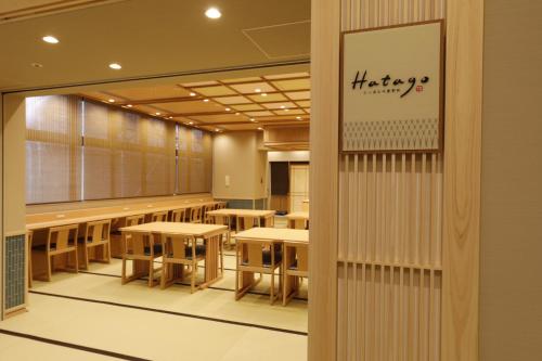 a classroom with tables and chairs in a building at Onyado Nono Asakusa Natural Hot Spring in Tokyo