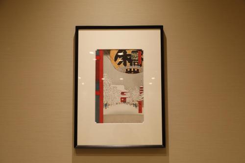a picture of a framed picture on a wall at Onyado Nono Asakusa Natural Hot Spring in Tokyo