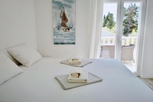 Postel nebo postele na pokoji v ubytování Apartments Ana Sutivan