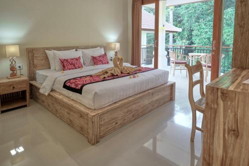 En eller flere senger på et rom på Gek House Ubud Bali