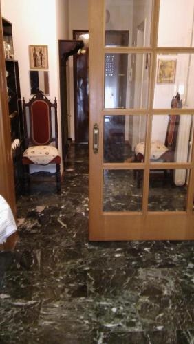 a room with a door and a marble floor at CHRYSSA - ΧΡΥΣΑ in Patra
