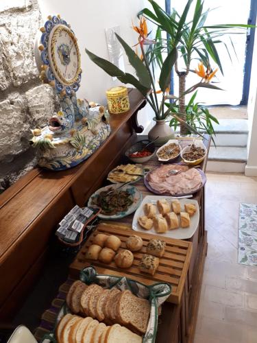 a table filled with lots of different types of food at Villa Manning Relais in Sorrento