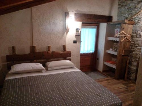 Llit o llits en una habitació de Agri-b&b Lou Col