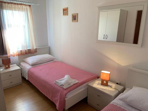 Ένα ή περισσότερα κρεβάτια σε δωμάτιο στο Apartments Ema